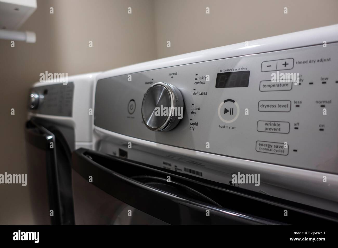 Close up of a knob and button panel on a high end, energy efficient clothing dryer Stock Photo