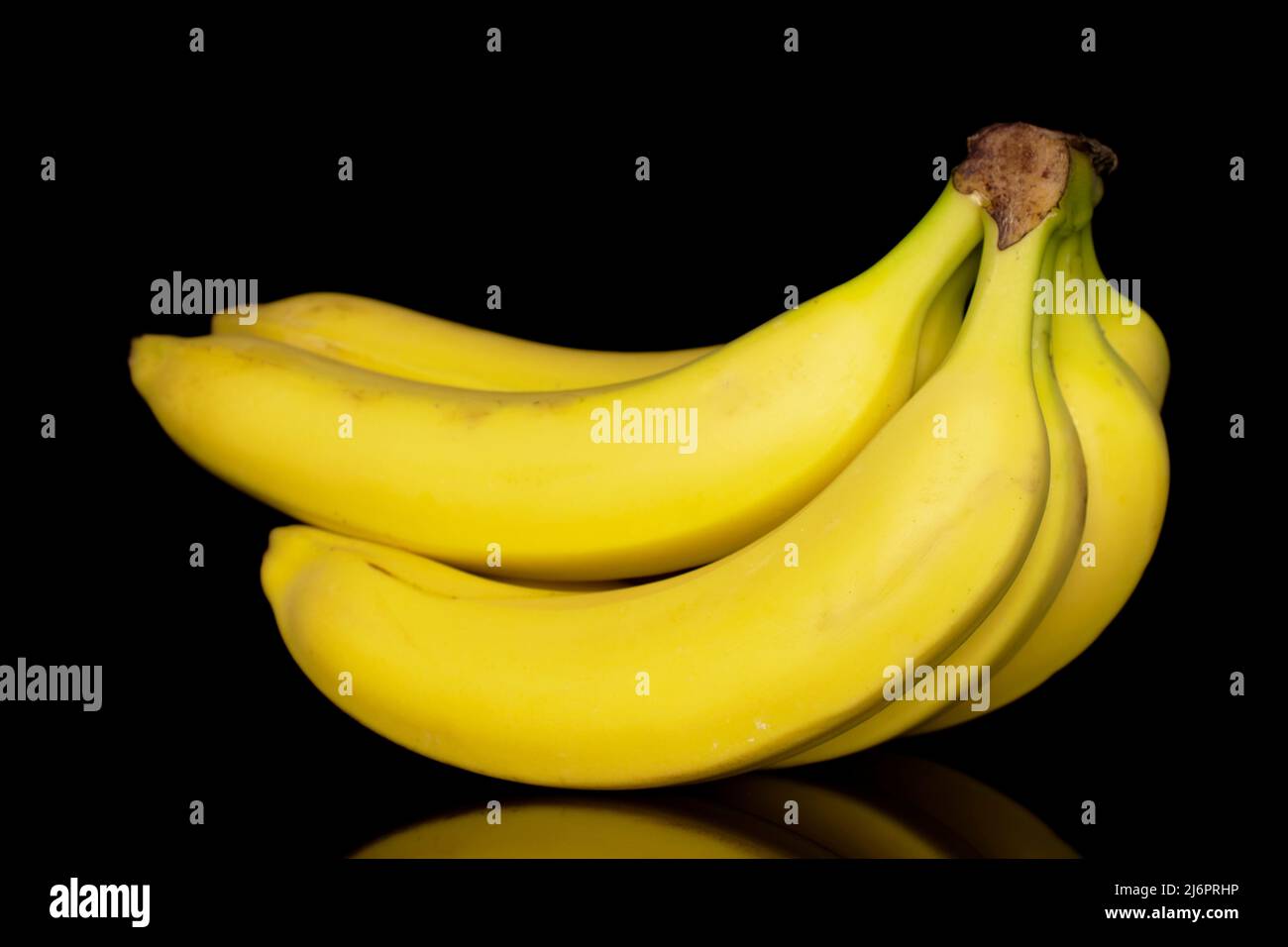 https://c8.alamy.com/comp/2J6PRHP/one-ripe-bunch-of-bananas-close-up-isolated-on-a-black-background-2J6PRHP.jpg