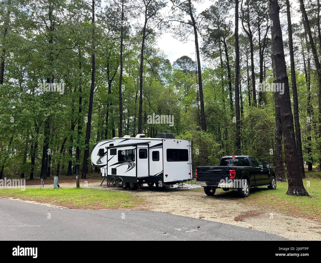 A fifth wheel rv set up for camping at the Santee State Park in South Carolina, USA. Stock Photo