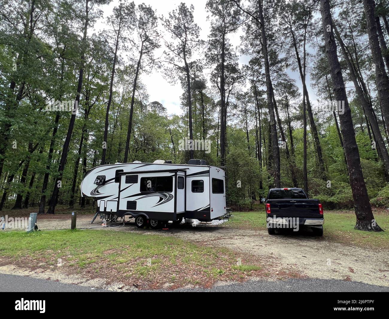 A fifth wheel rv set up for camping at the Santee State Park in South