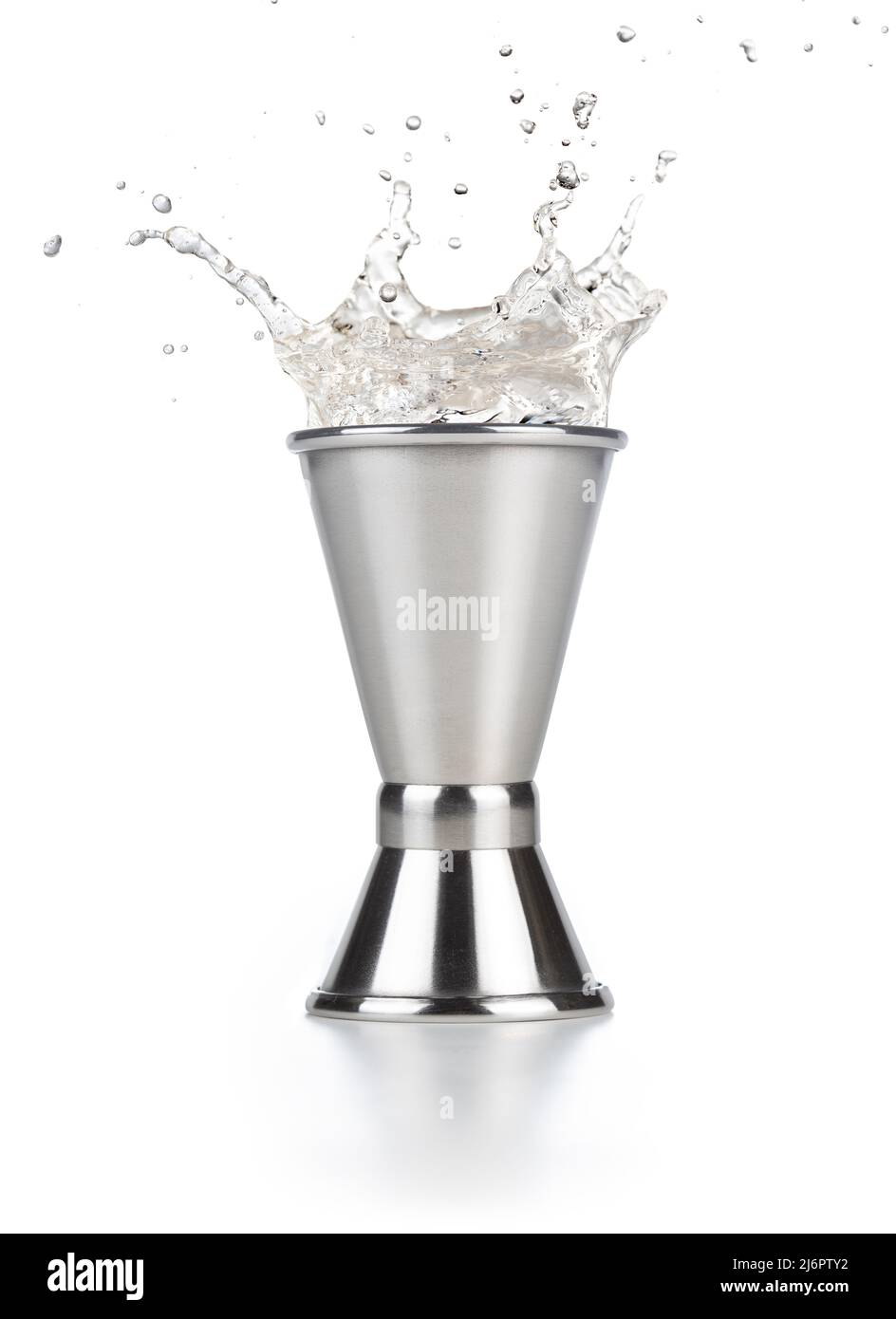 alcohol splashing out of a steel jigger isolated on white Stock Photo