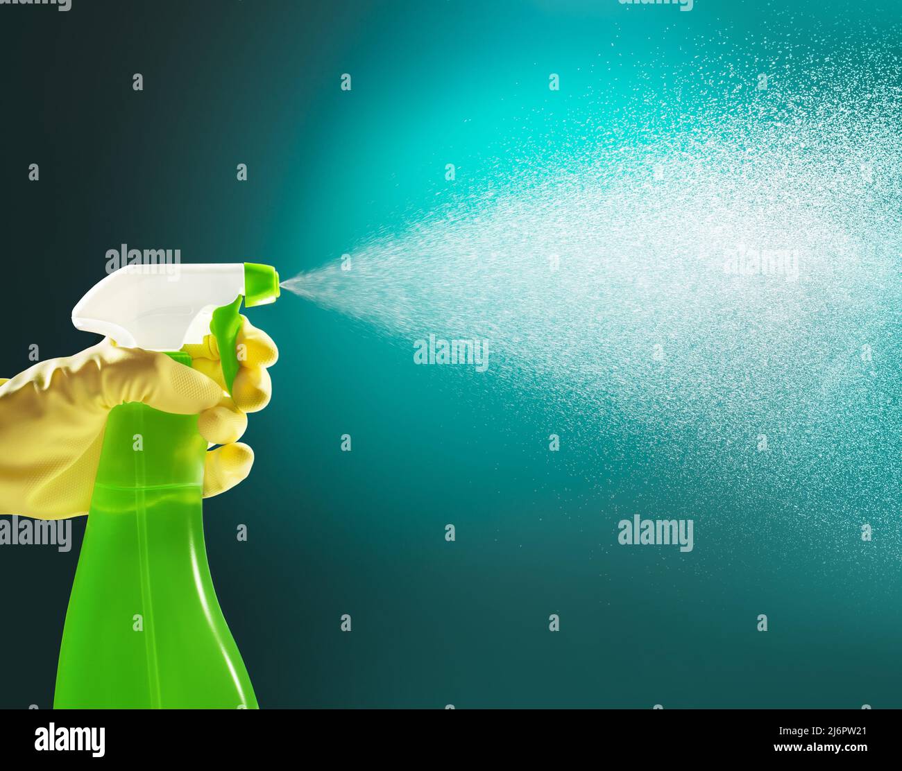 hand holding a pump cleanser bottle spraying liquid Stock Photo