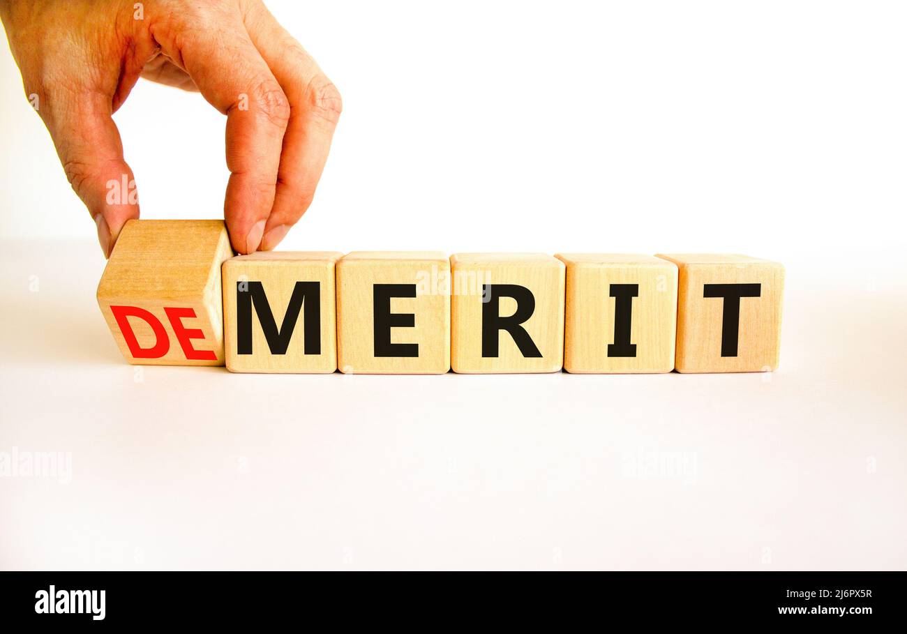 Demerit or merit symbol. Businessman turns wooden cubes and changes the ...