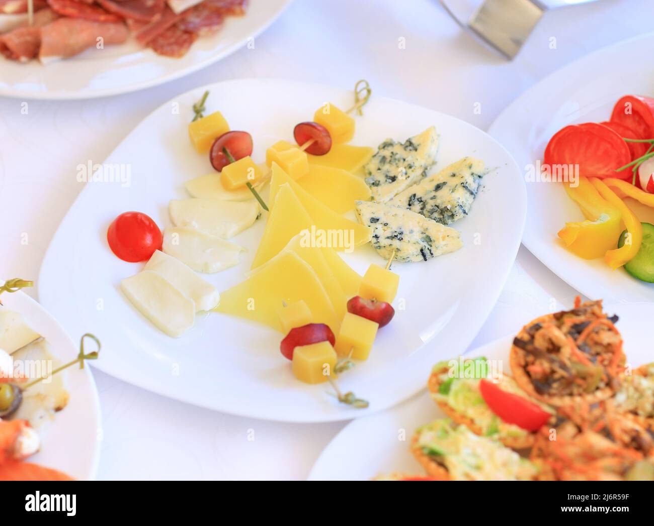 catering table set service with silverware and glass stemware at