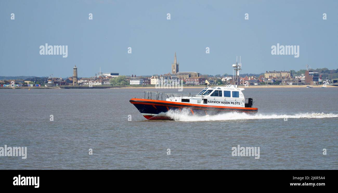 Harwich Haven Pilot  boat on the river Orwell with Harwich in background. Stock Photo