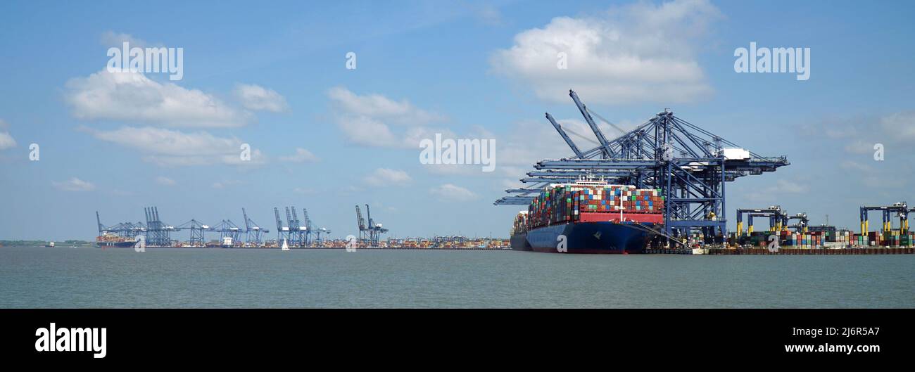 Container ships being loaded and unloaded at Felixstowe docks Suffolk Panorama  England. Stock Photo