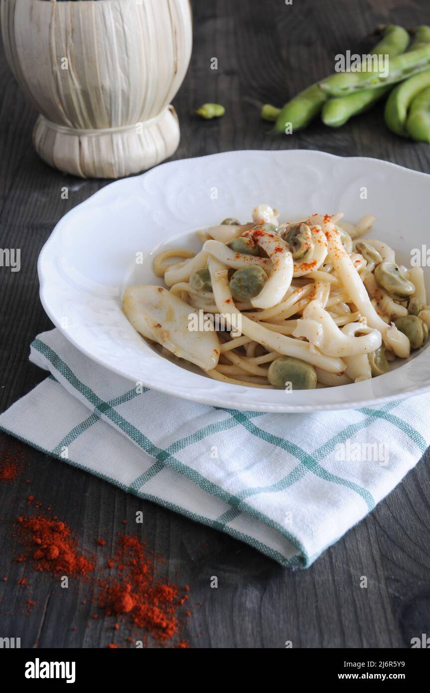 Spaghettoni with cuttlefish and fresh beans in season, excellent first course Stock Photo