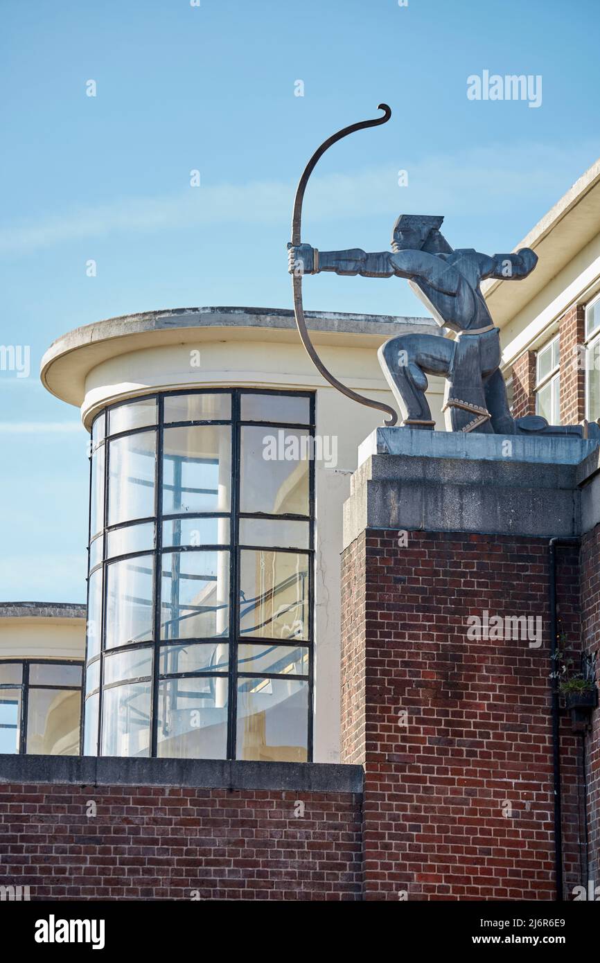 East Finchley, a grade 2 listed tube station on the Northern line designed by Charles Holden with the Archer Statue by Eric Aumonier Stock Photo