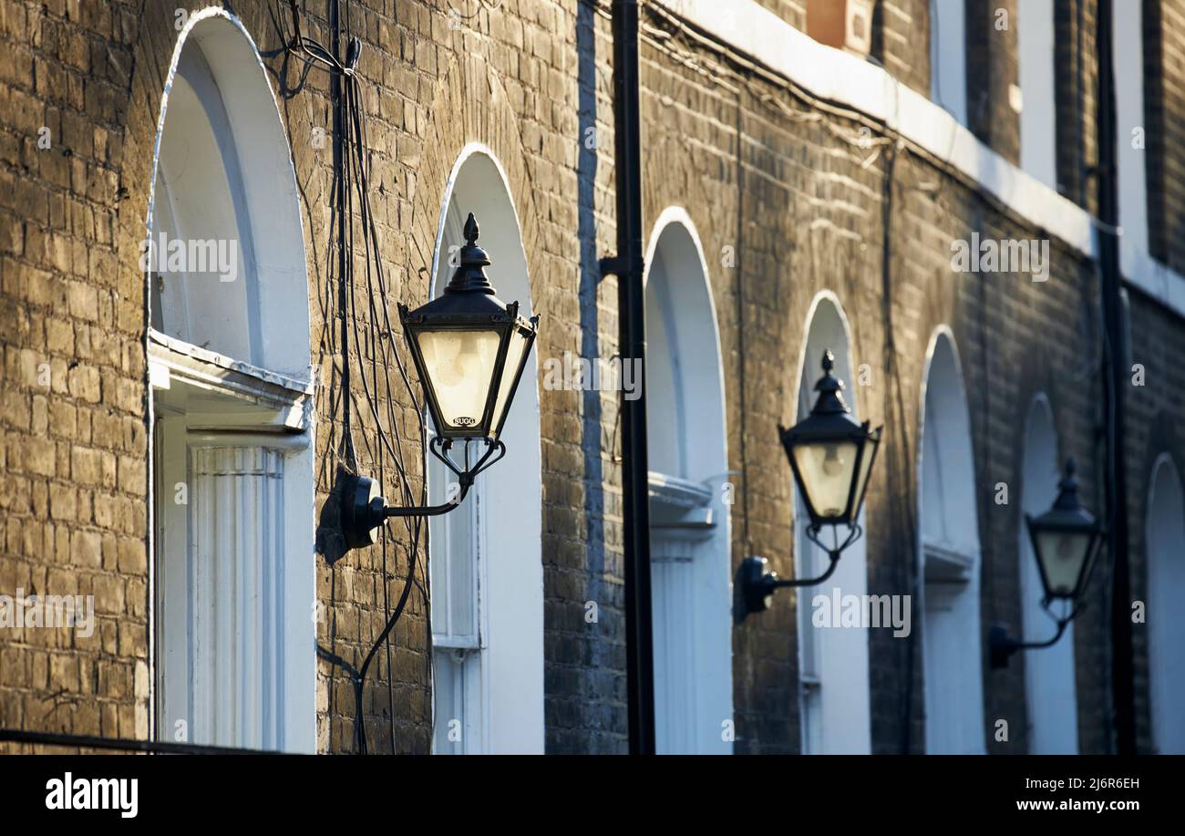Lamps and Arches of the terraced housing in Sekforde Street, London, UK. Stock Photo