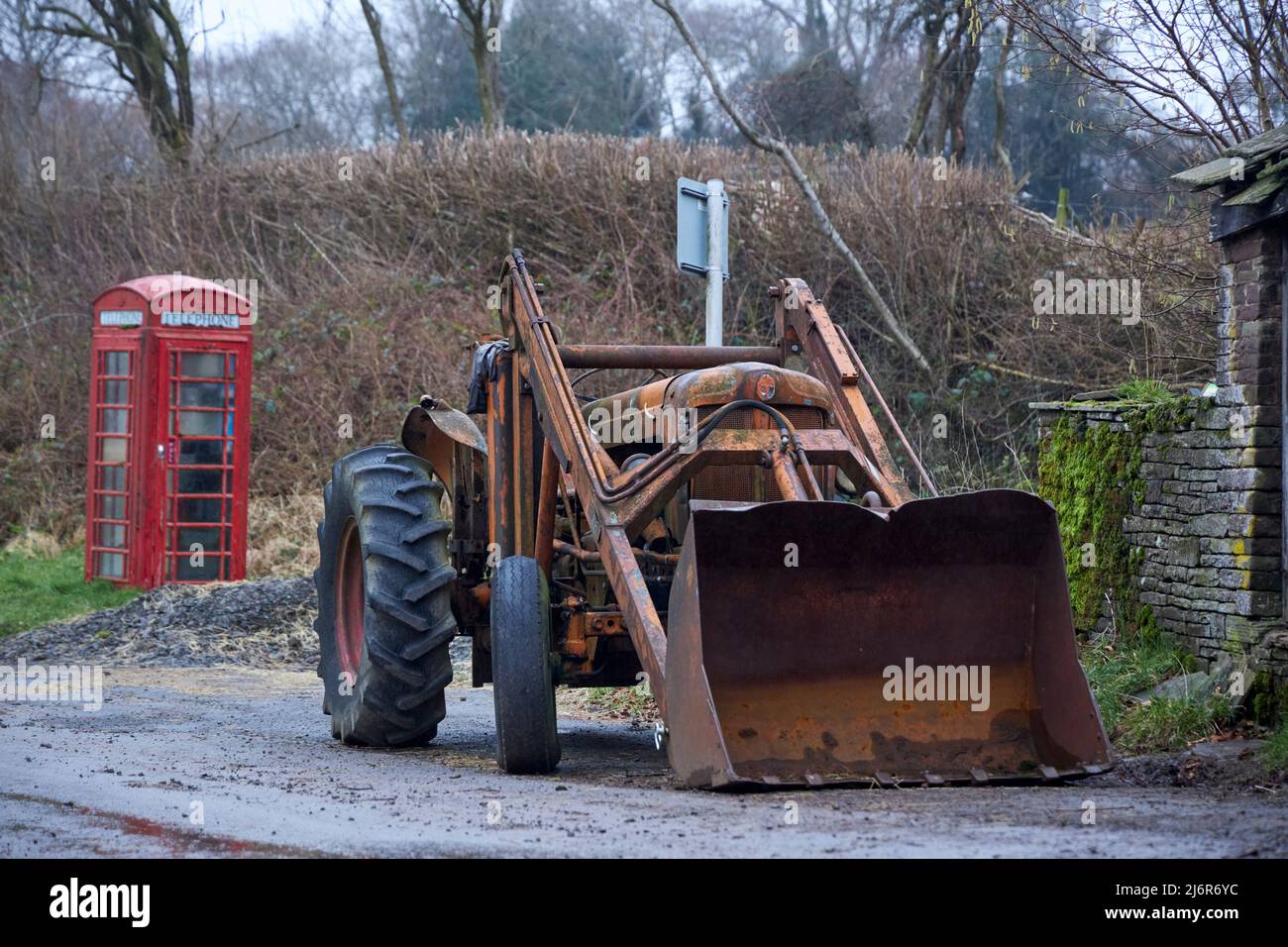 Rusty old Fordson Major Tractor with digger attachment. Stock Photo