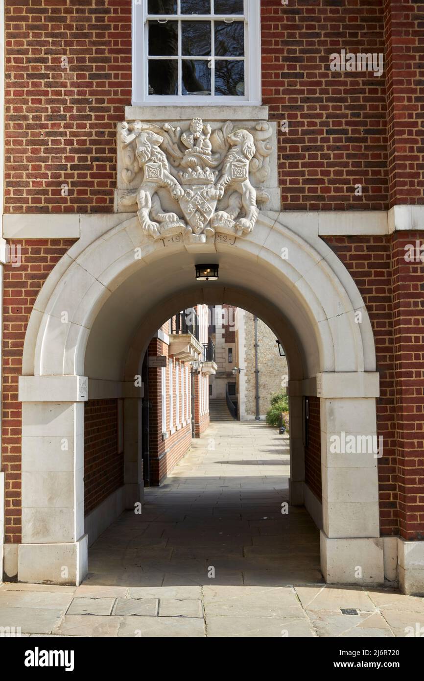 Arch on Temple lane with Coat of Arms Stone carving. Stock Photo
