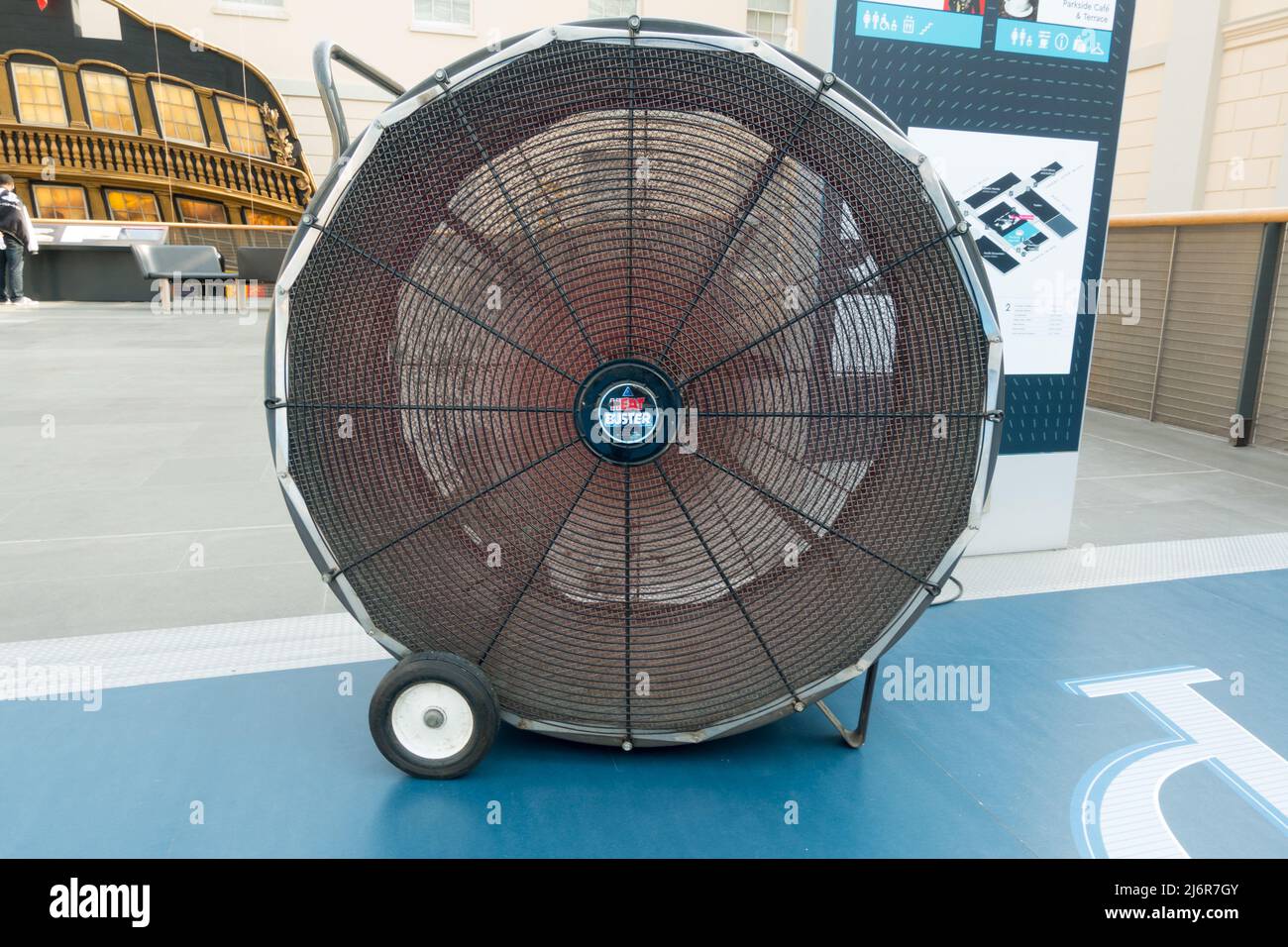 Large Industrial fan with wheels on base used as a temporary source of cool air in the Greenwich maritime museum Stock Photo