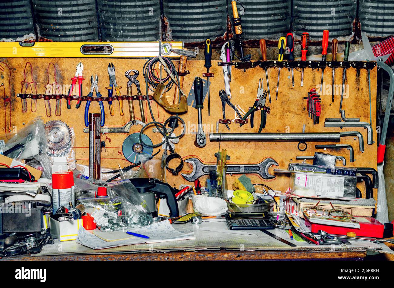 Tools Rpeiring Workshop with tools. Collection of various repair tools hanging on wall ...