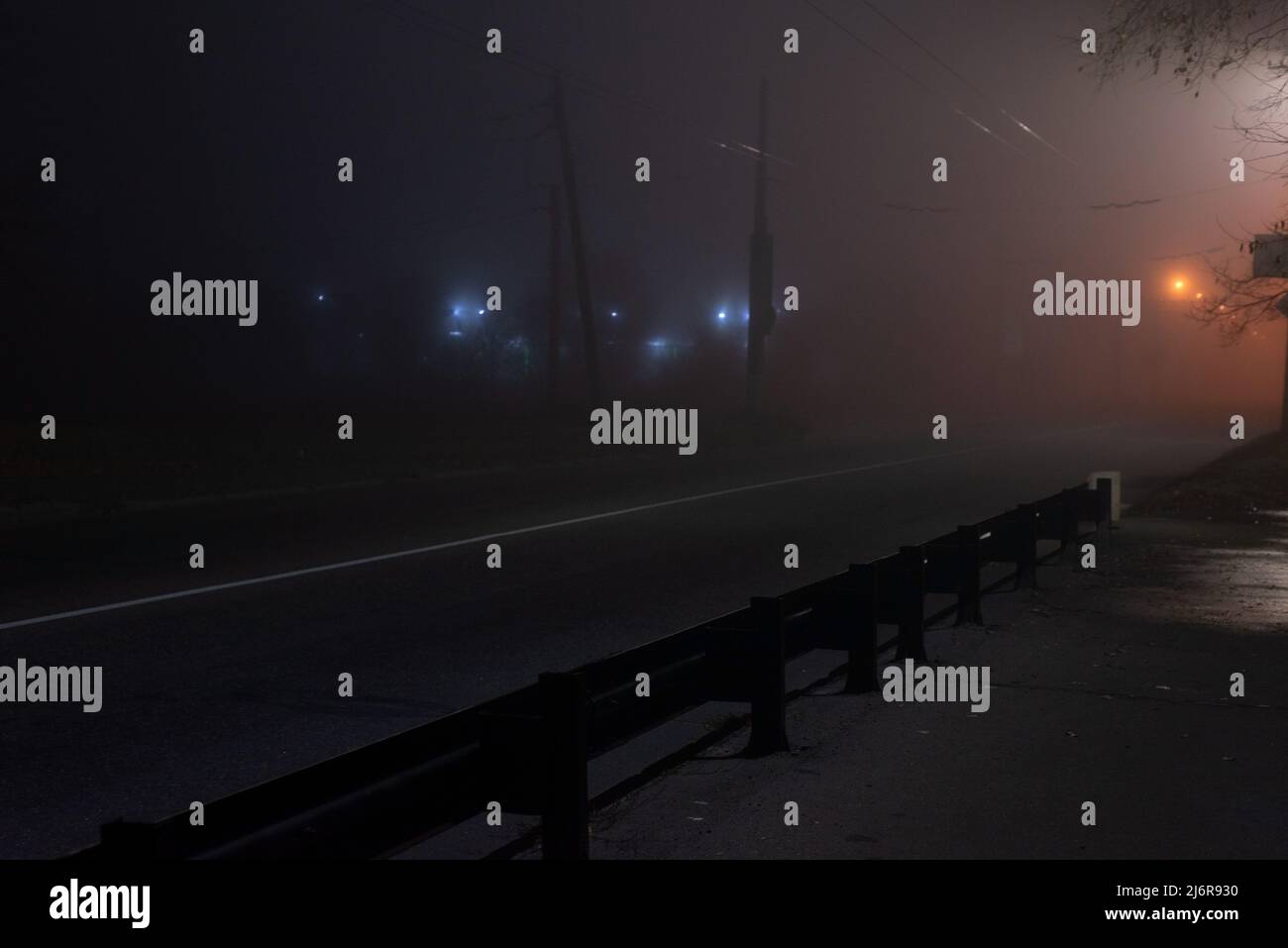 landscape foggy night deserted road with lanterns Stock Photo - Alamy
