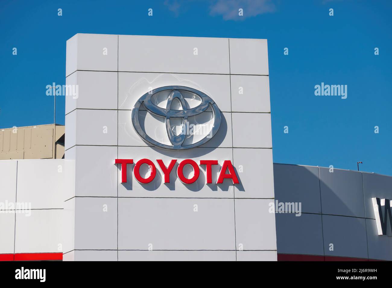 Toyota logo on the exterior of Pitt Meadows car dealership, Pitt Meadows, B. C., Canada. Stock Photo