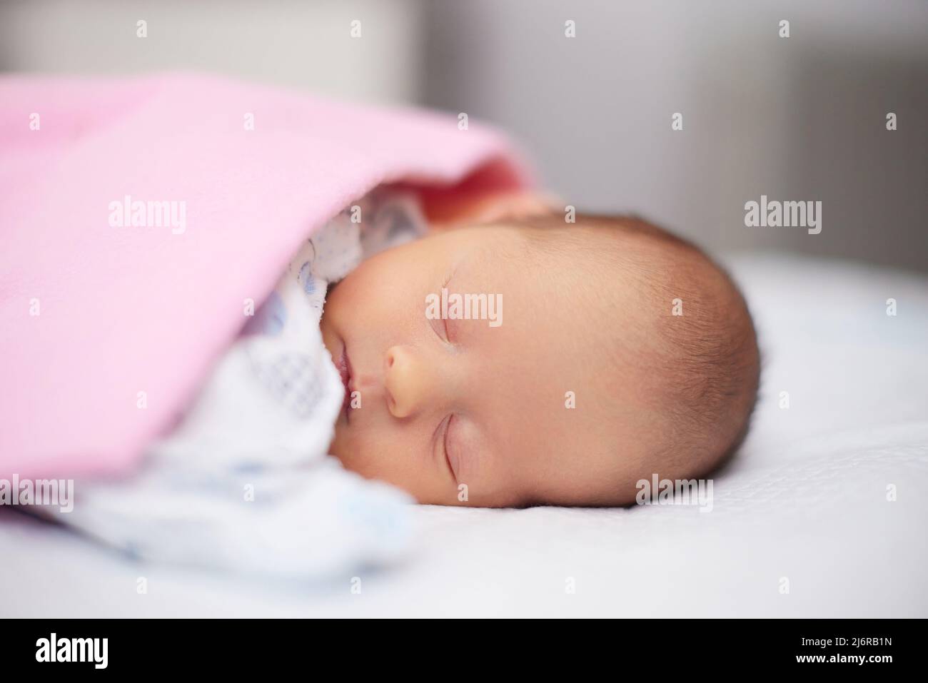 adorable new born baby sleeping in bed Stock Photo Alamy