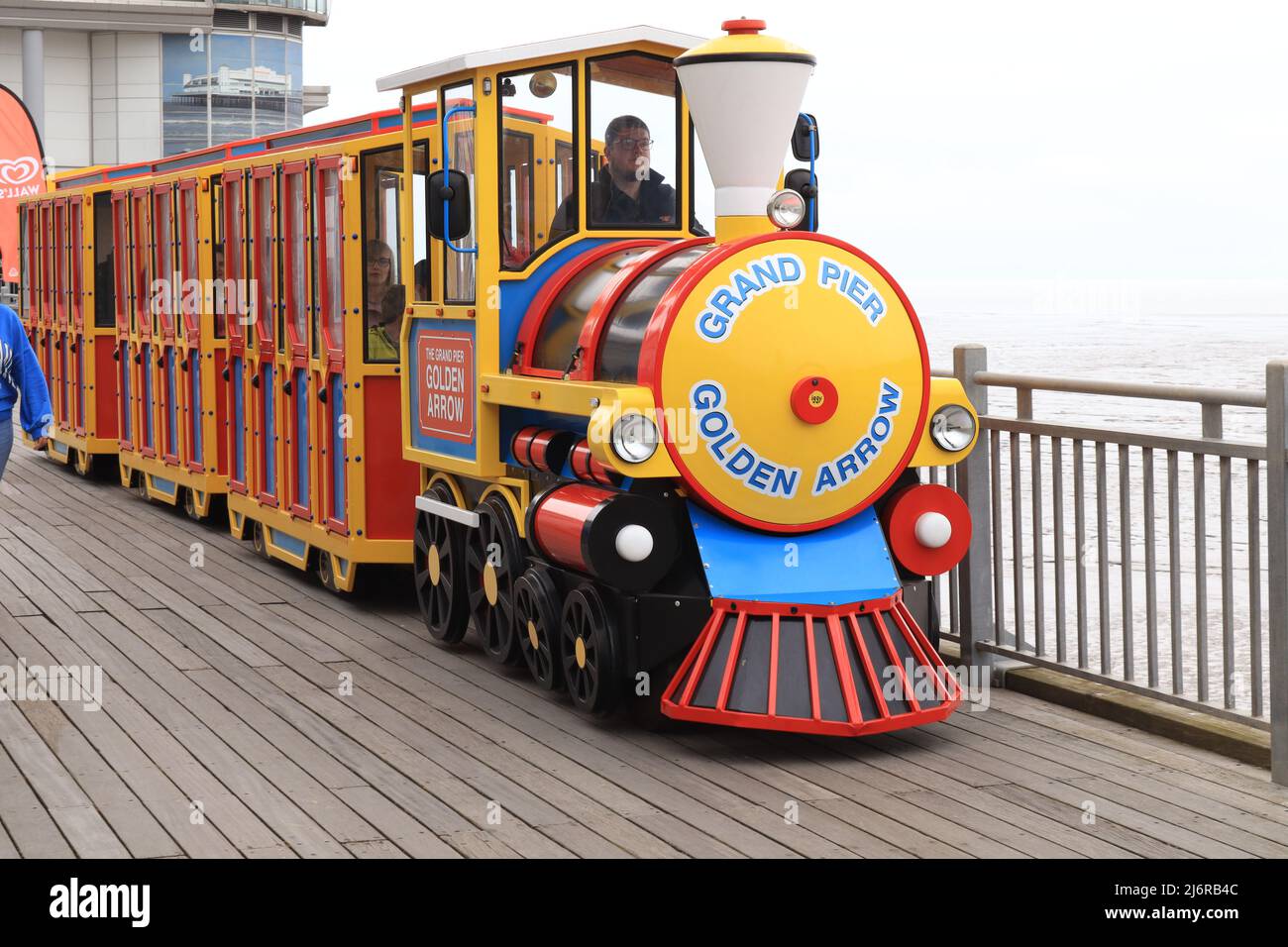 Weston-super-Mare, UK - May 2nd 2022 - Grand Pier Golden Arrow land train in transit Stock Photo