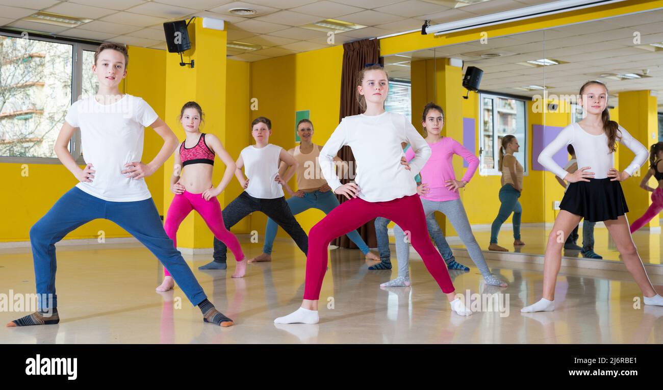 Teenagers practicing dance in studio Stock Photo