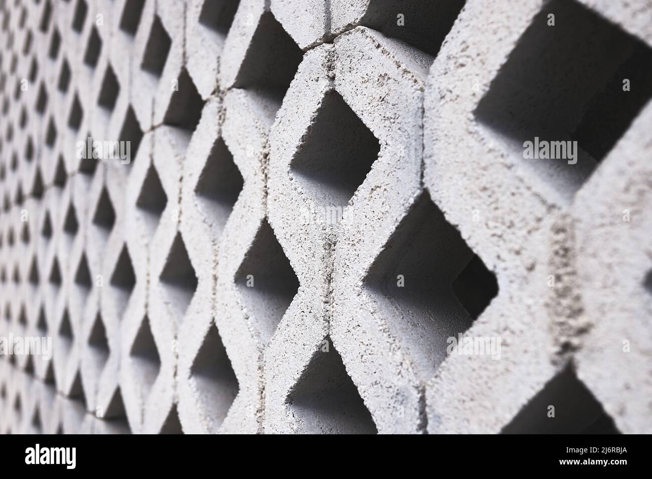 gray concrete lattice wall in diamond shape Stock Photo