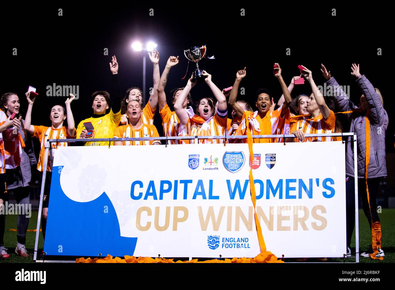 London, England. 03/05/2022, Ashford celebrating winning the Capital Womens Senior Cup final between Ashford (Middlesex) and Dulwich Hamlet at Meadowbank in London, England.  Liam Asman/SPP Stock Photo