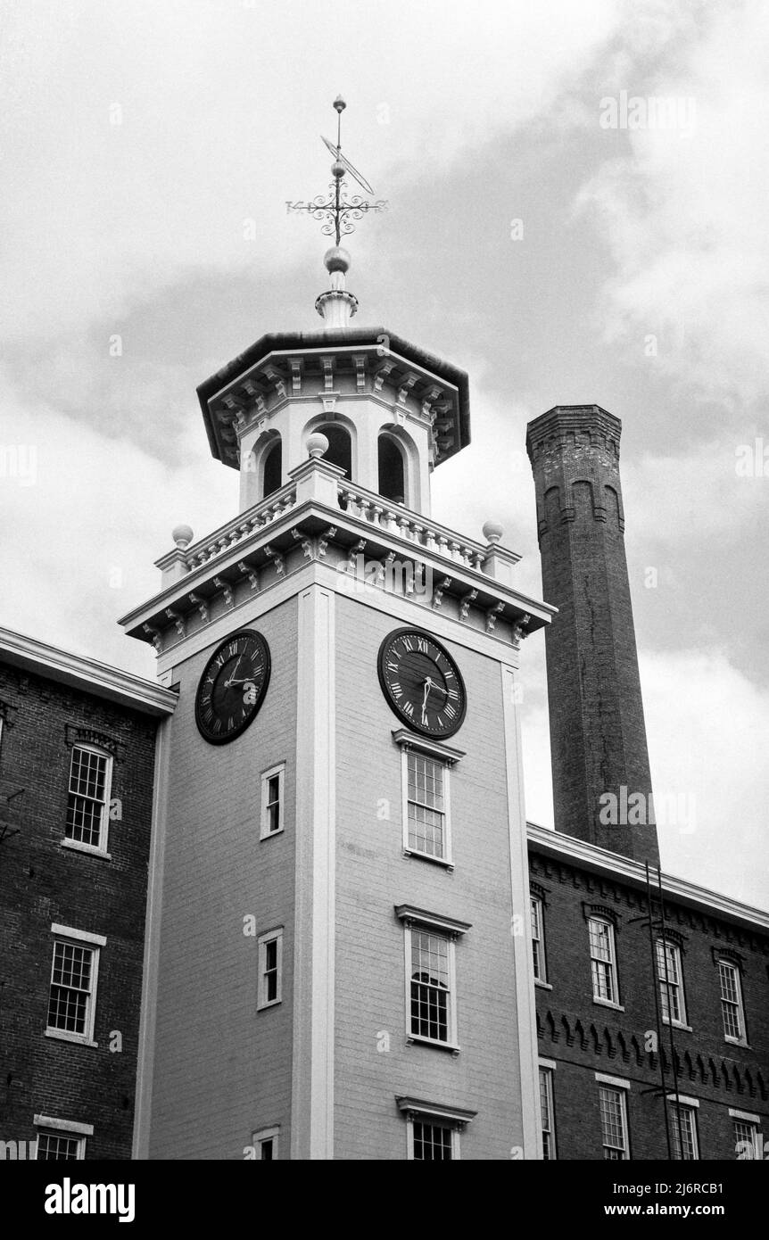 The clock tower at the Boott Cotton Mills Museum in historic Lowell, Massachusetts. Captured on analog black and white film. Lowell, Massachusetts. Stock Photo