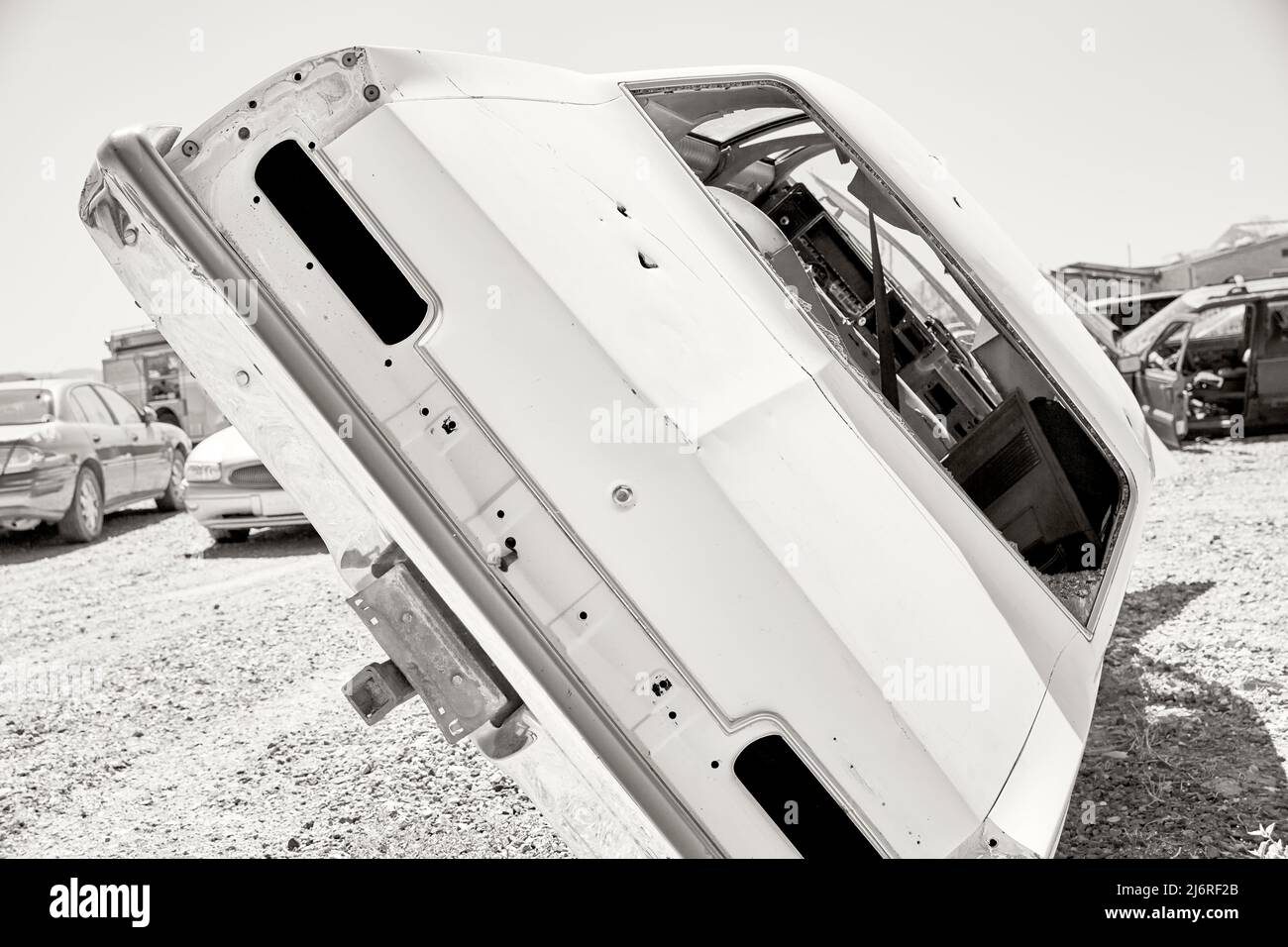 Wrecked car sitting on its side Stock Photo