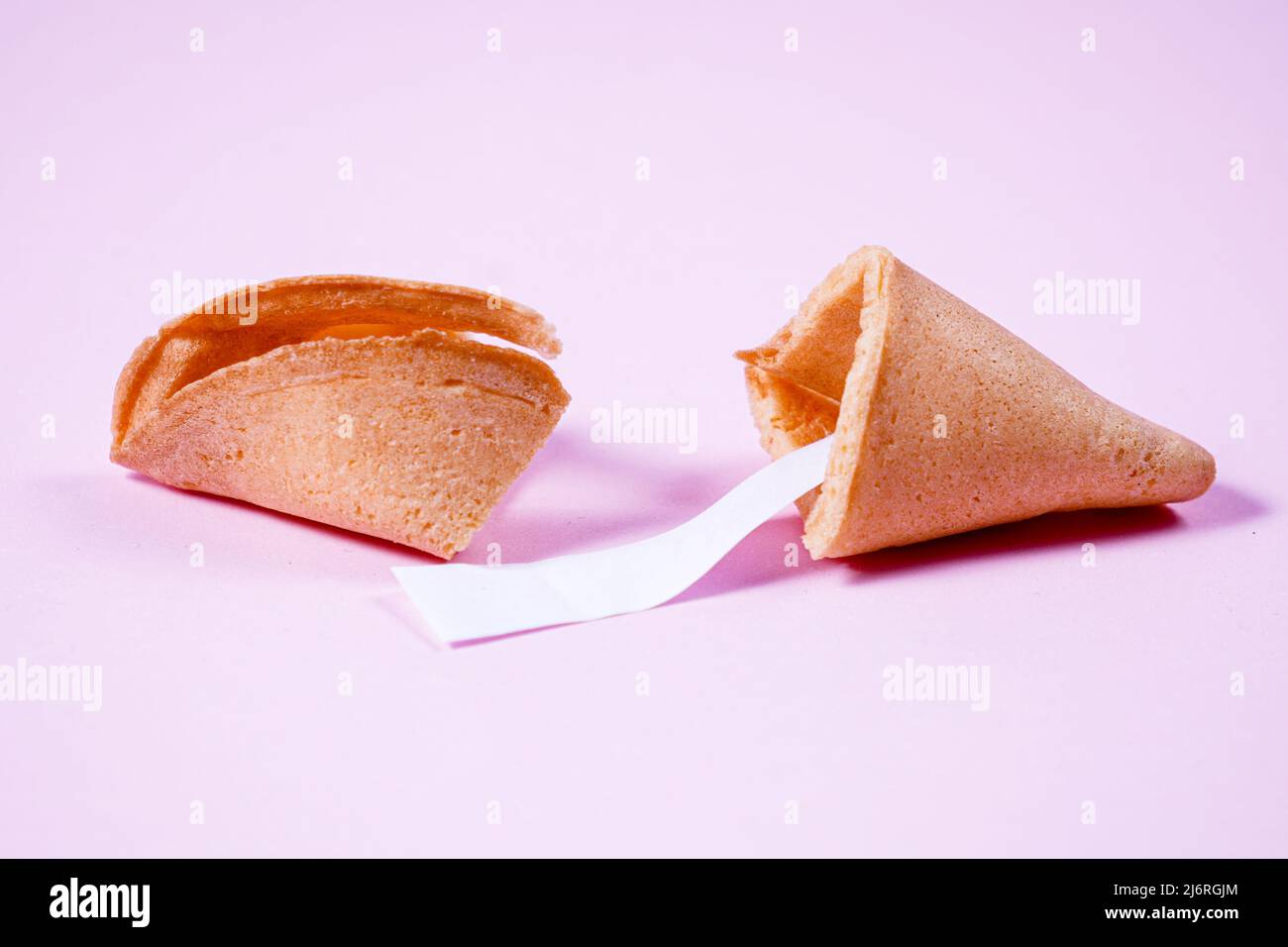 Chinese fortune cookies. Cookies with empty space for prediction words. pink background. Stock Photo