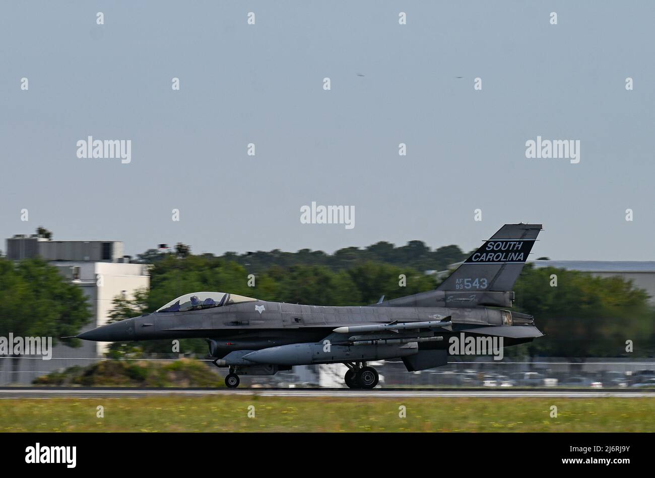 A U.S. Air Force F-16 Fighting Falcon jet from the 169th Fighter Wing, South Carolina Air National Guard, takes off from the Savannah-Hilton Head Int’l Airport, Georgia on May 2, 2022 on the first day of Sentry Savannah 2022, the Air National Guard’s premier 4th and 5th generation counter air exercise. This total force integrated exercise showcases the nation's combat aircraft readiness, tests the capabilities of our warfighters in a near-peer environment and trains our next generation of fighter pilots for tomorrow’s fight. (U.S. Air National Guard photo by Tech. Sgt. Caila Arahood) Stock Photo