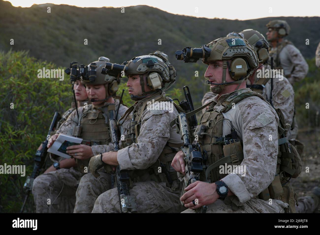 U.S. Marines with Maritime Raid Force, 13th Marine Expeditionary Unit, review a map of the target area during Ground Interoperability Course at Marine Corps Base Camp Pendleton, California, April 25, 2022. The focus of the Maritime Raid Force Interoperability Exercise is to integrate all elements of the MRF into a comprehensive and cohesive raid force, capable of conducting and supporting MEU operations while forward deployed to the Indo-Pacific region. (U.S. Marine Corps photo by Cpl. Nicolas Atehortua) Stock Photo