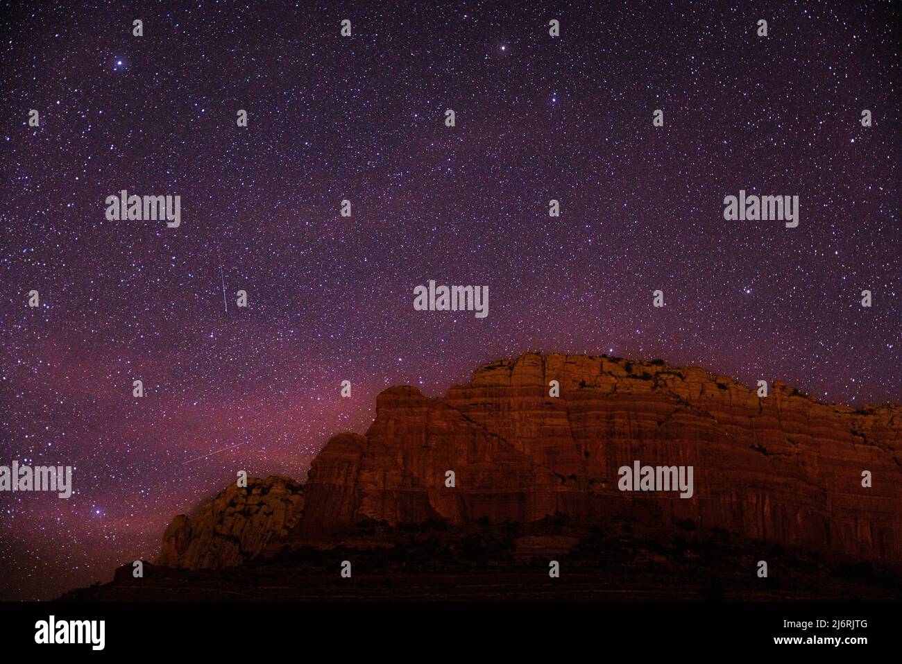 night sky with stars over red desert mesa Stock Photo