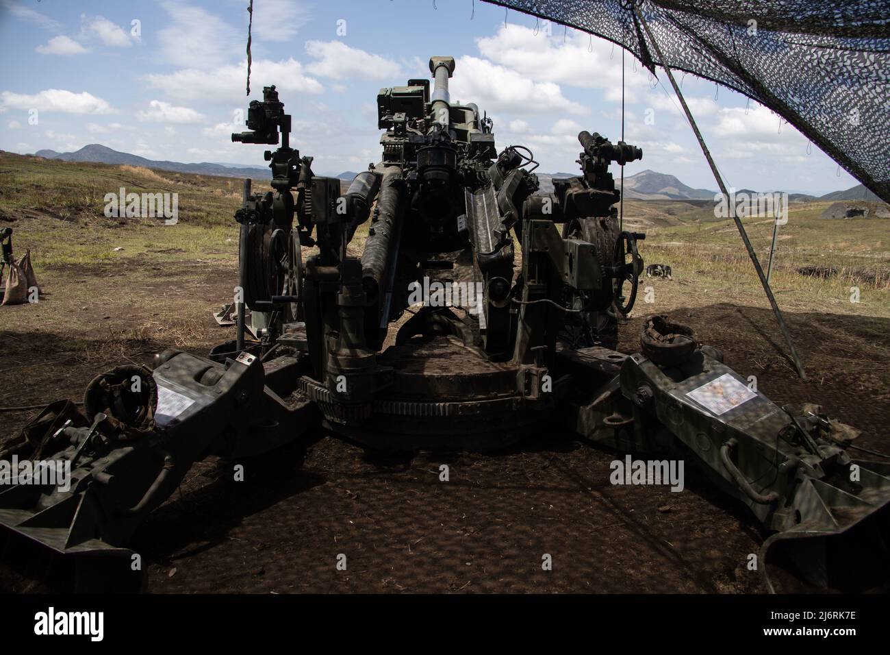 U.S. Marines assigned to 3d Battalion, 12th Marines, 3d Marine Division emplace an M777 towed 155 mm howitzer during Artillery Relocation Training Program 22.1 at the Japan Ground Self-Defense Force Hijudai Training Area, Japan, April 14, 2022. The skills developed at ARTP increase the proficiency and readiness of the only permanently forward-deployed artillery unit in the Marine Corps, enabling them to provide precision indirect fires. (U.S. Marine Corps photo by Sgt. Jennifer Andrade) Stock Photo