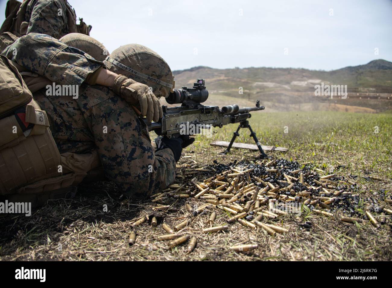 U.S. Marines assigned to 3d Battalion, 12th Marines, 3d Marine Division fire M240B machine guns during a crew-served weapons range as part of Artillery Relocation Training Program 22.1 at the Japan Ground Self-Defense Force Hijudai Training Area, Japan, April 14, 2022. The skills developed at ARTP increase the lethality and proficiency of the only permanently forward-deployed artillery unit in the Marine Corps, providing long-range precision indirect fires throughout the Indo-Pacific Region.  (U.S. Marine Corps photo by Sgt. Jennifer Andrade) Stock Photo