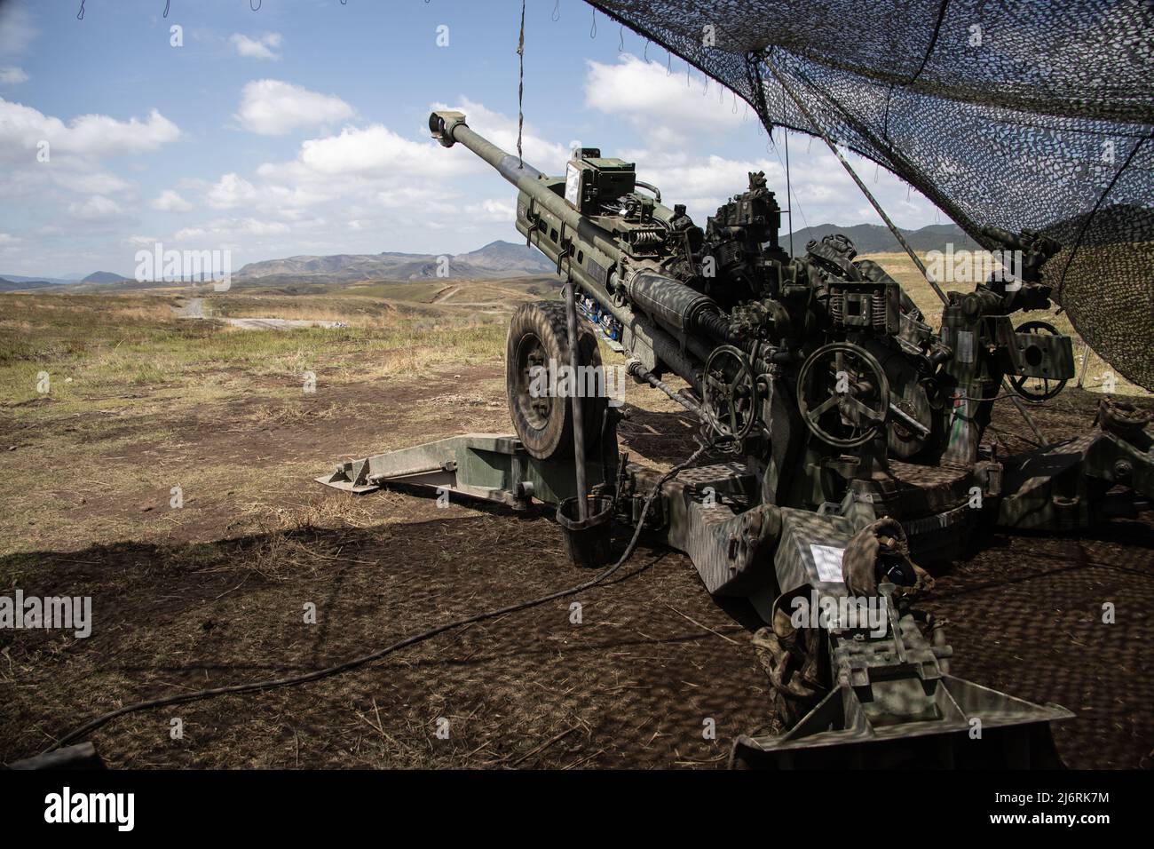 U.S. Marines assigned to 3d Battalion, 12th Marines, 3d Marine Division emplace an M777 towed 155 mm howitzer during Artillery Relocation Training Program 22.1 at the Japan Ground Self-Defense Force Hijudai Training Area, Japan, April 14, 2022. The skills developed at ARTP increase the proficiency and readiness of the only permanently forward-deployed artillery unit in the Marine Corps, enabling them to provide precision indirect fires. (U.S. Marine Corps photo by Sgt. Jennifer Andrade) Stock Photo