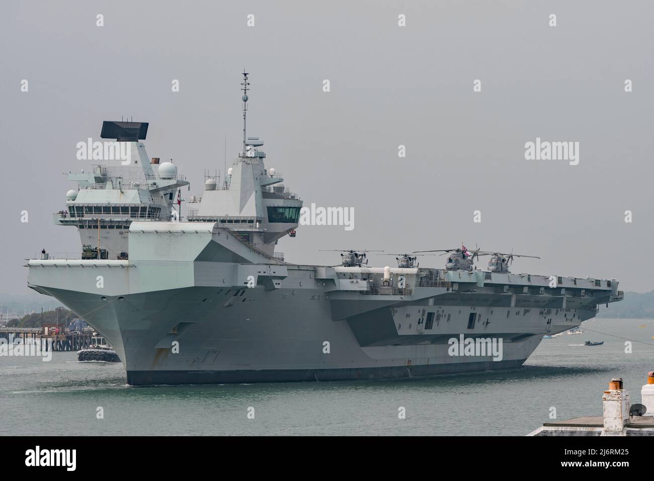 HMS Queen Elizabeth (R08) departed Portsmouth, UK on the 3rd May 2022 for sea training, with Merlin and Wildcat helicopters on deck. Stock Photo