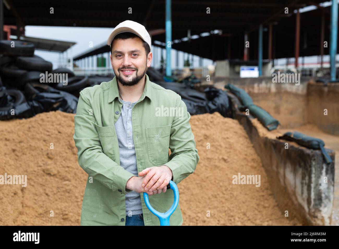 Portrait of man farmer with shovel Stock Photo - Alamy