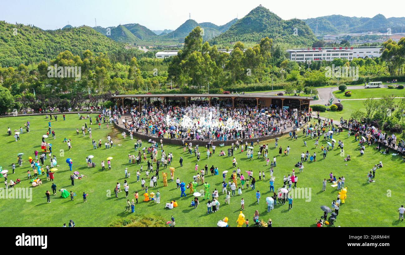 QIANXINAN, CHINA - MAY 3, 2022 - Tourists experience dream bubbles at an ecological sports park in Qianxinan Buyi and Miao Autonomous Prefecture, Sout Stock Photo