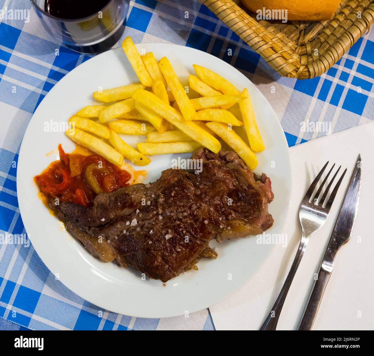 Beef entrecote with pickled vegetables served at plate, spanish cuisine