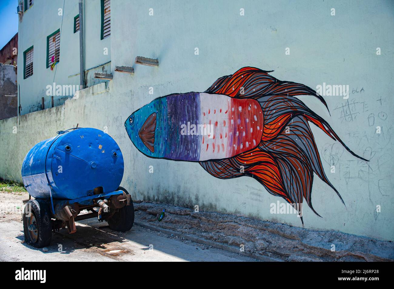 Mural artwork of a colorful fish swimming with image of a tic-tac-toe game on a building wall in Havana, Cuba. Stock Photo