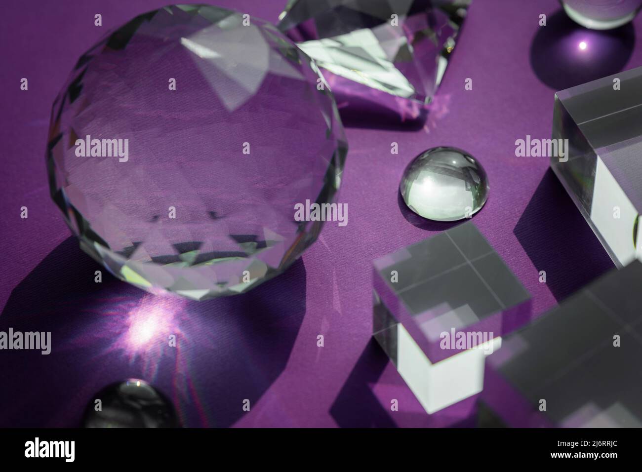 Crystal prism refracting light, magic crystals and pyramid, sphere and