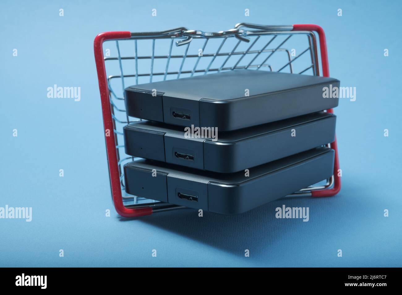 A stack of hard drives in a basket. Stock Photo