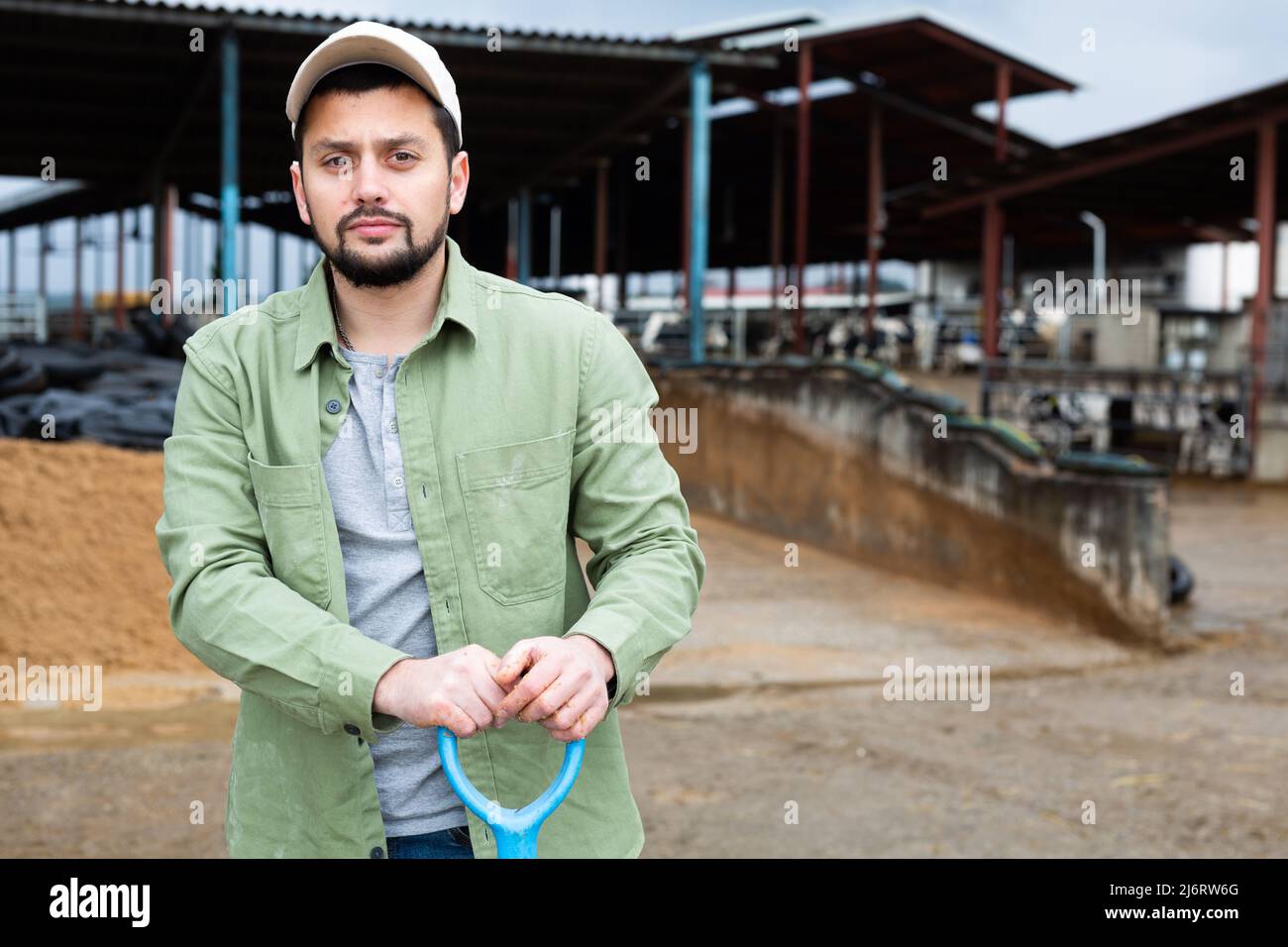 Portrait of man farmer with shovel Stock Photo - Alamy