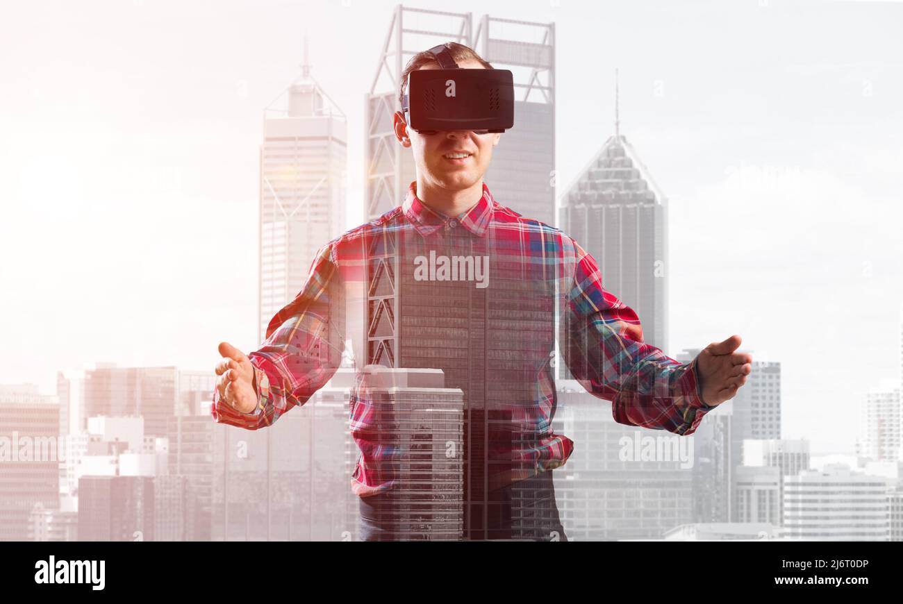 Guy wearing checked shirt and virtual mask stretching hands and trying