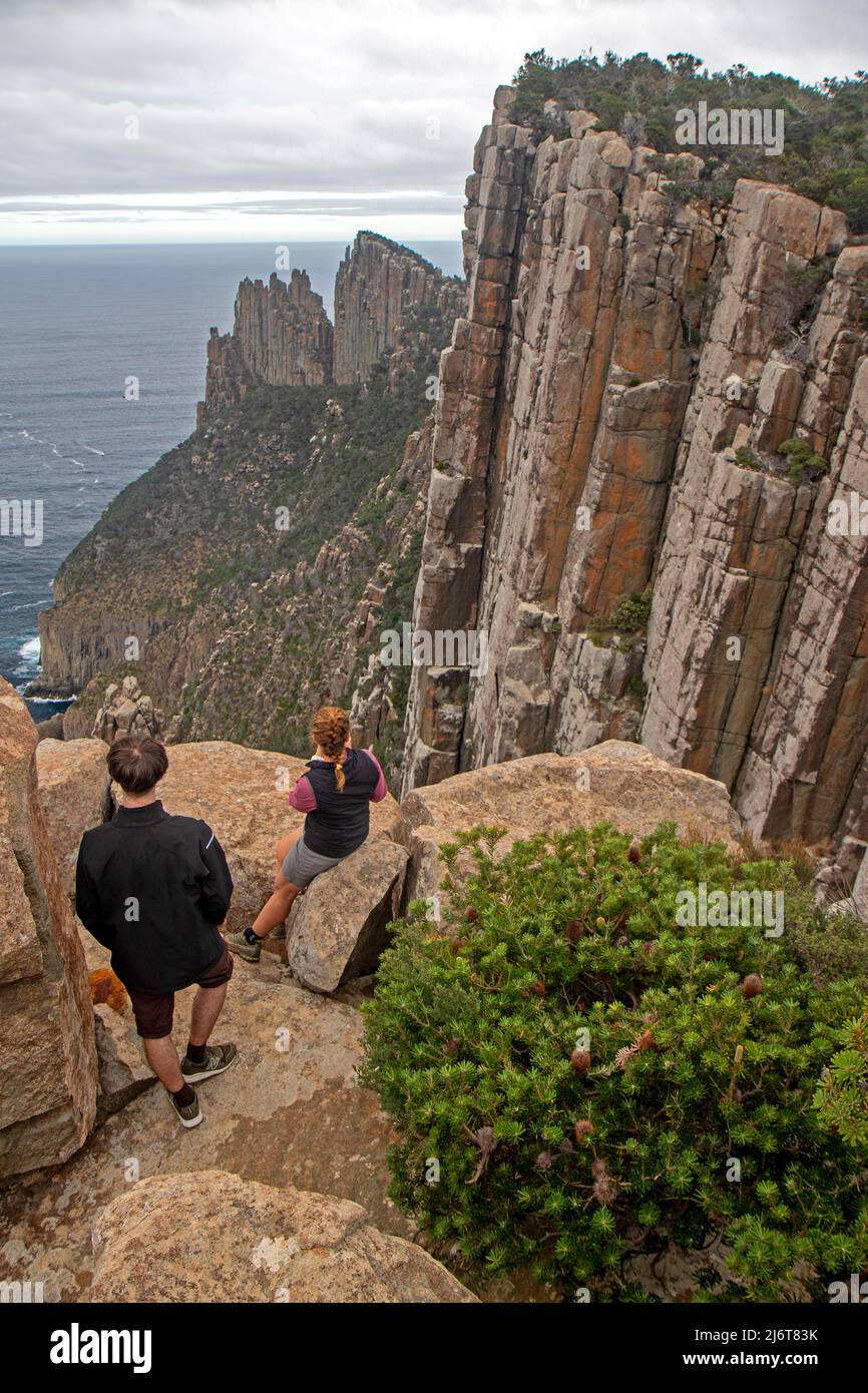 Three Capes Track hikers on Cape Pillar Stock Photo