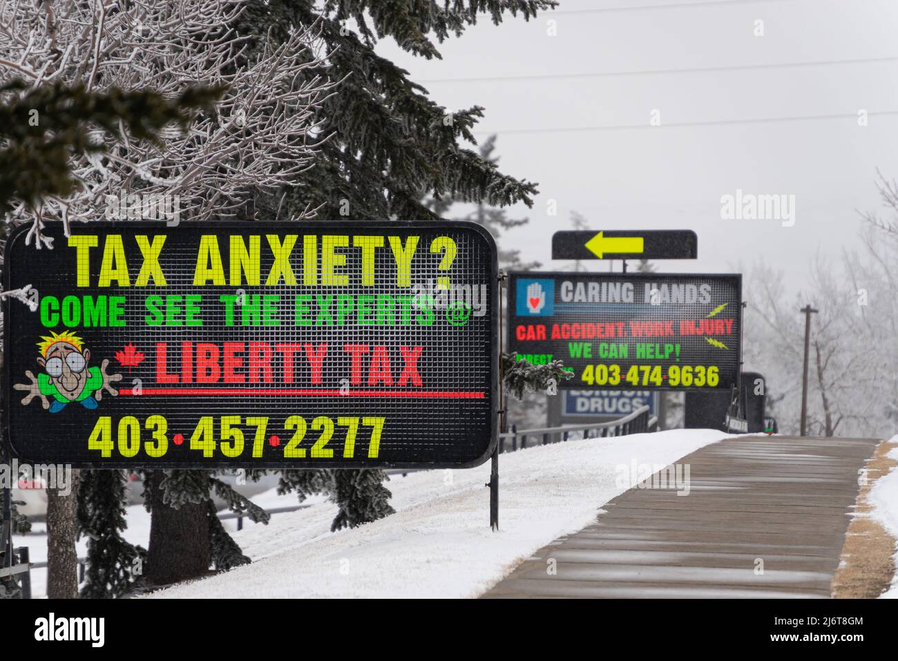 March 3 2022 Calgary Alberta Canada Tax preparer sign on pavement