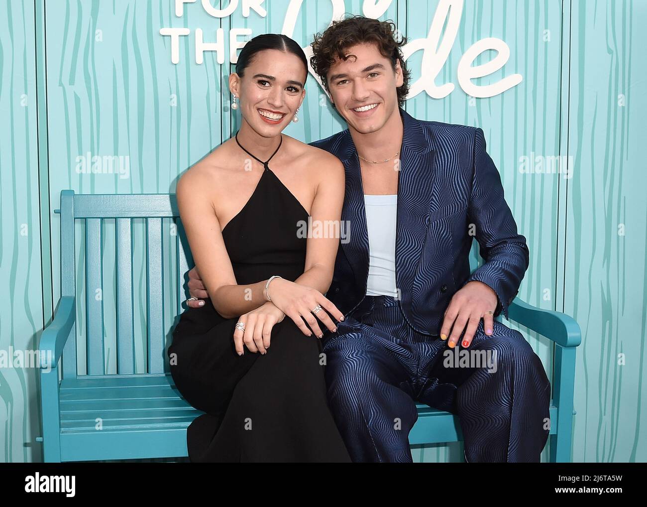 Emma Pasarow and Belmont Calmeli walking on the red carpet at the