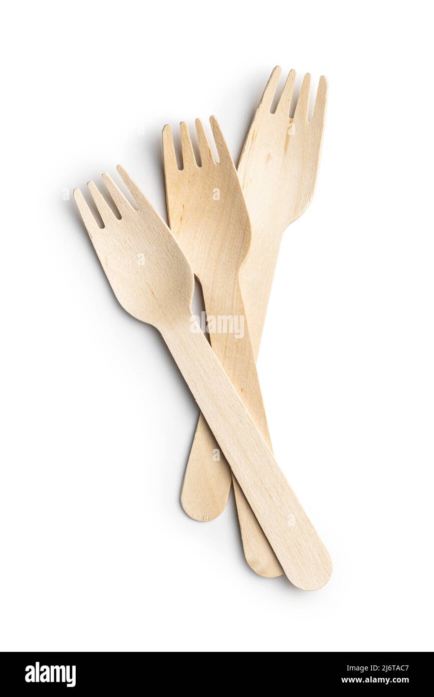 Wooden disposable fork isolated on a white background. Timber biodegradable fork made of natural eco recycle reusable material. Stock Photo