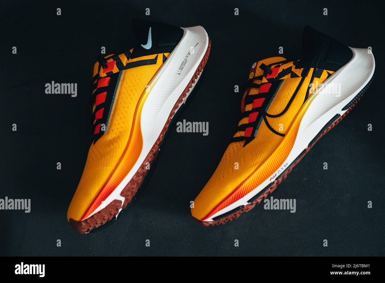 PARIS, FRANCE, MAY 3. 2022: Nike running shoes Pegasus 38 in yellow, black,  red and orange colors. Shoes with Zoom X Foam Stock Photo - Alamy