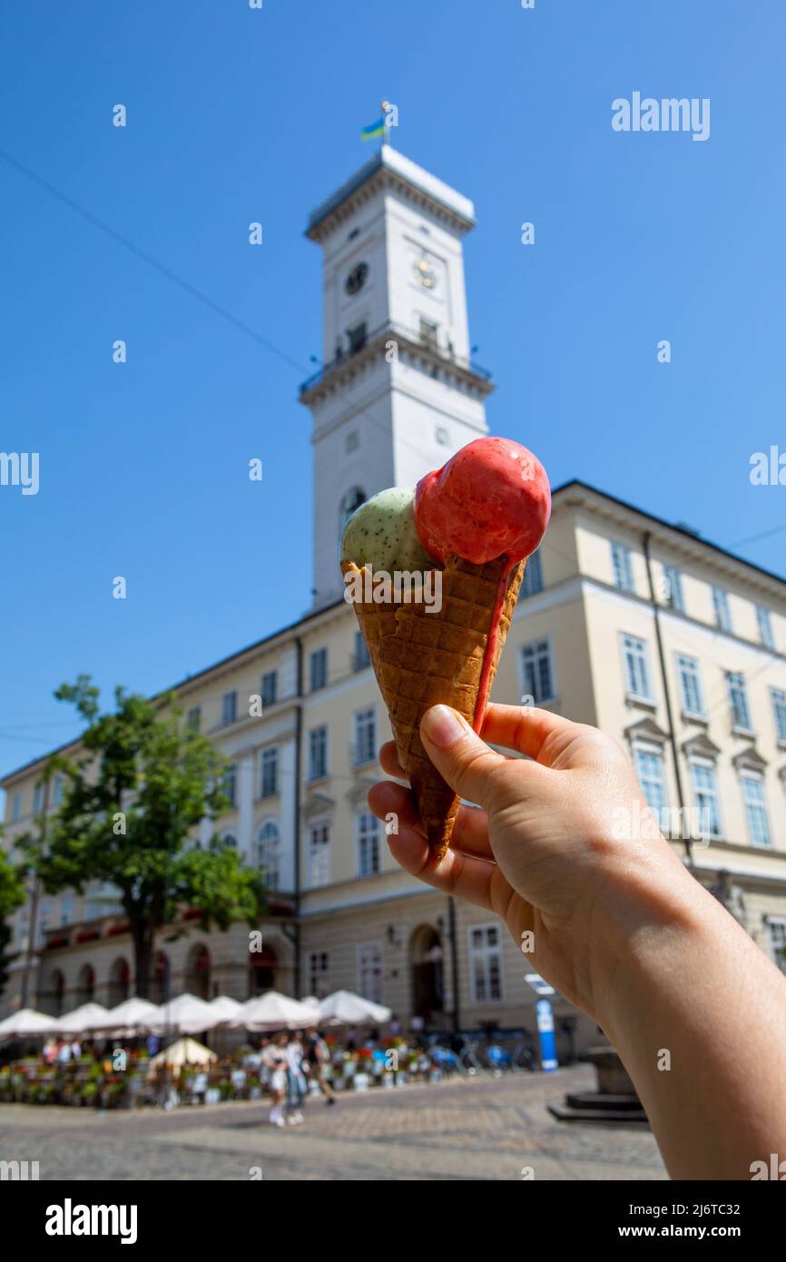Eating ice cream at hot summer day at Lviv city center Ukraine Stock