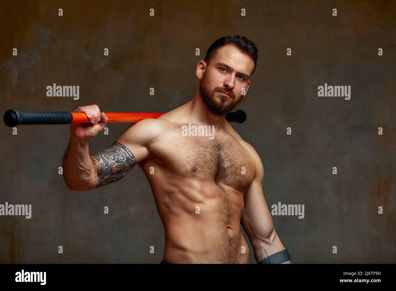 A fighter or karate man, stands in a fighting artificially pose and