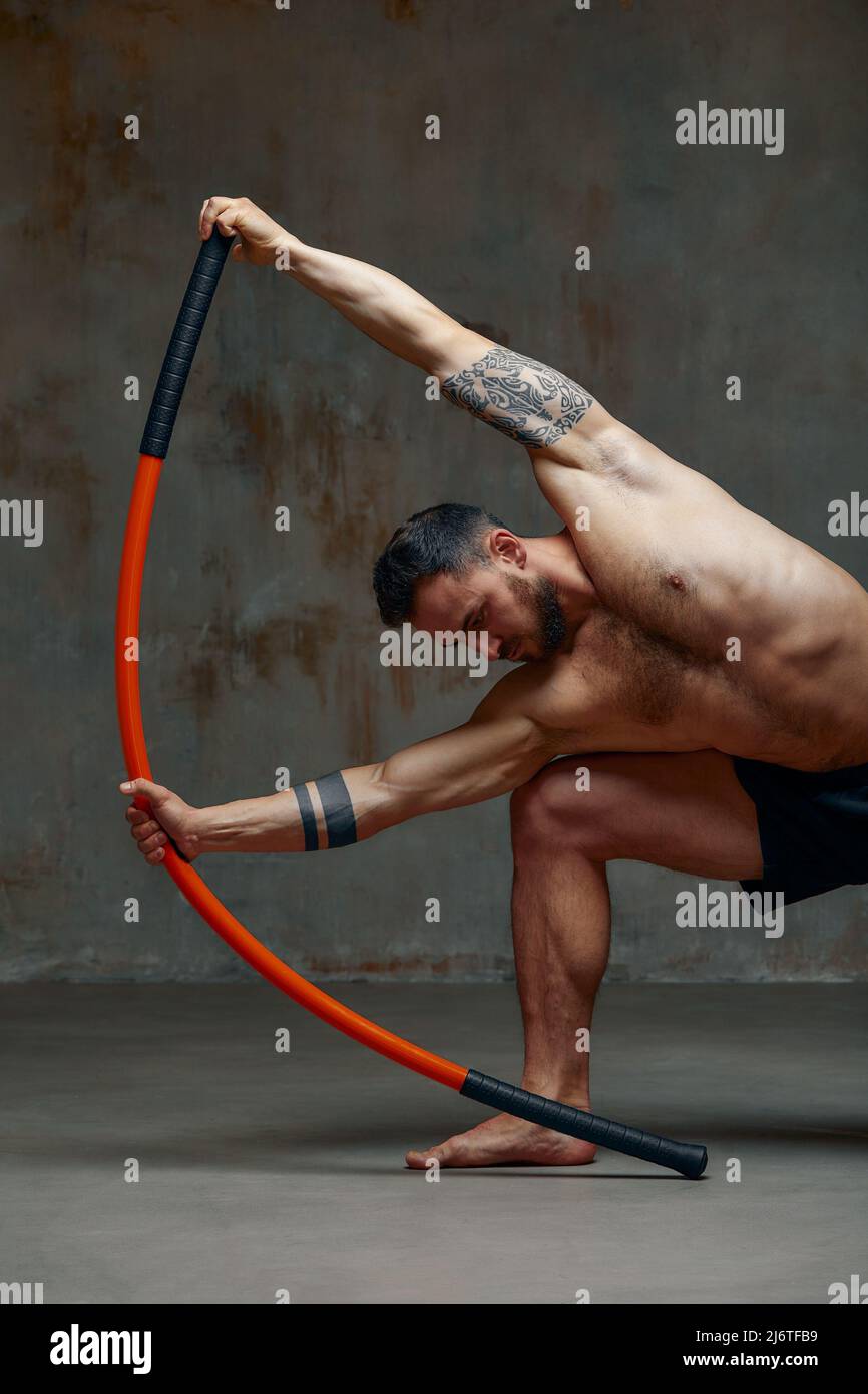 A fighter or karate man, stands in a fighting artificially pose and